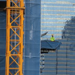 Construction worker on external lift