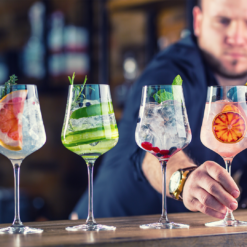 Bartender serves various Gin and Tonics